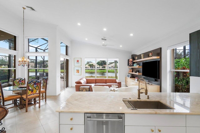 kitchen featuring light tile patterned flooring, a sink, white cabinetry, dishwasher, and crown molding