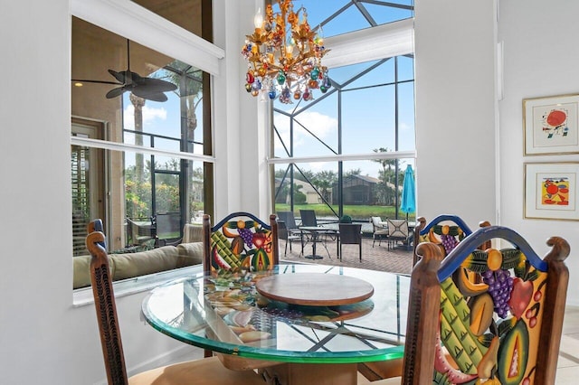 interior space with a towering ceiling and ceiling fan