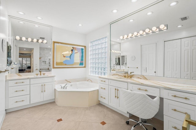 bathroom featuring recessed lighting, a closet, two vanities, visible vents, and a sink