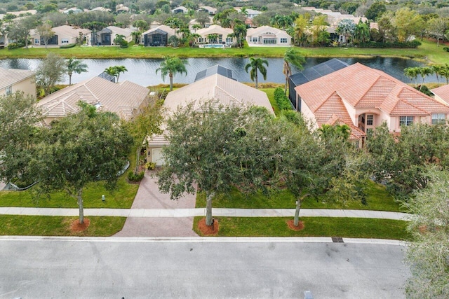 bird's eye view featuring a water view and a residential view