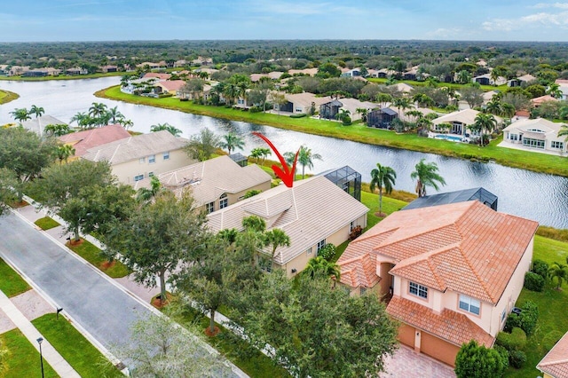 birds eye view of property featuring a water view and a residential view