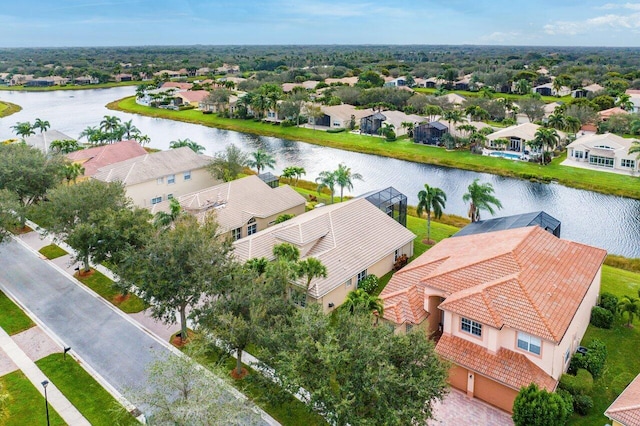 drone / aerial view with a residential view and a water view