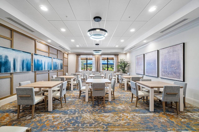 dining room featuring visible vents, dark colored carpet, and recessed lighting