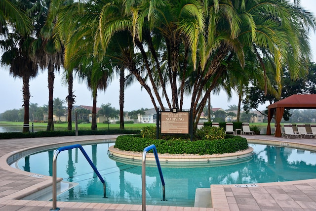 view of swimming pool featuring a gazebo