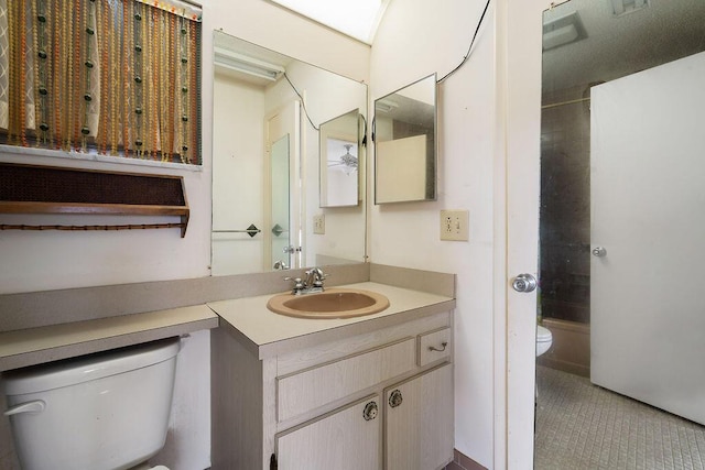 bathroom with shower / washtub combination, tile patterned flooring, vanity, and toilet