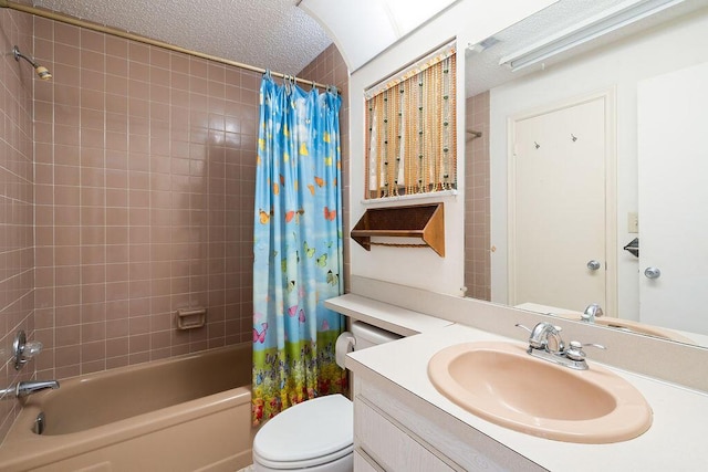 bathroom featuring toilet, shower / bathtub combination with curtain, a textured ceiling, and vanity