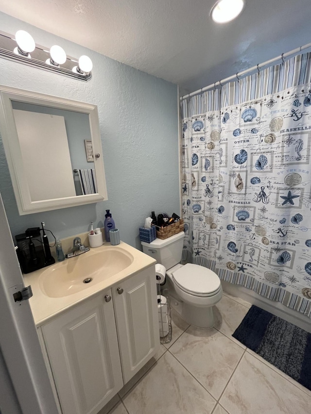 bathroom featuring a textured ceiling, a textured wall, toilet, a shower with shower curtain, and vanity