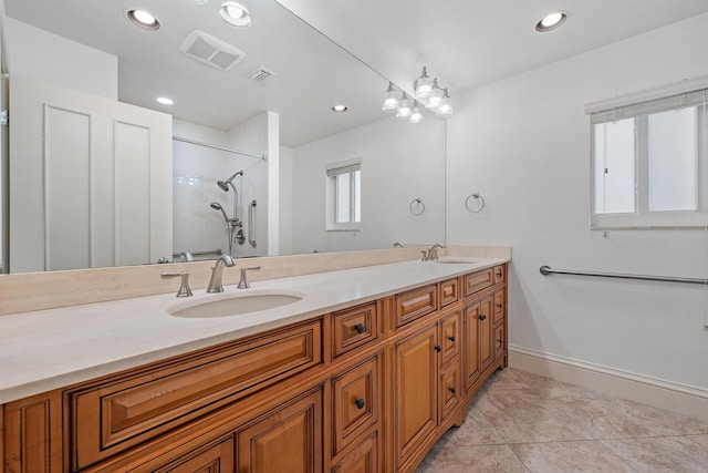 bathroom featuring double vanity, tile patterned flooring, a sink, and visible vents