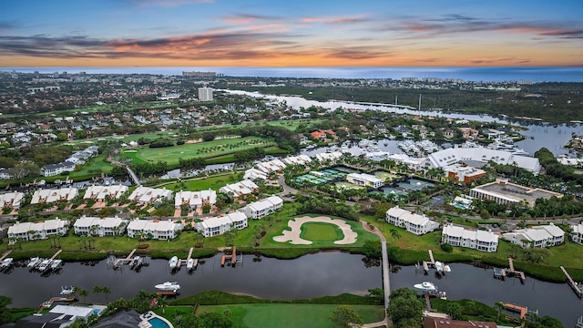 birds eye view of property featuring a water view and a residential view