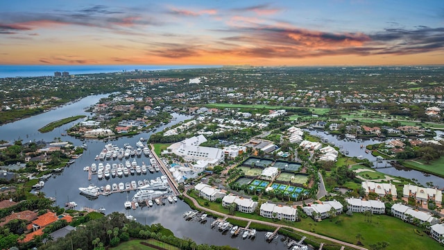 aerial view at dusk with a water view