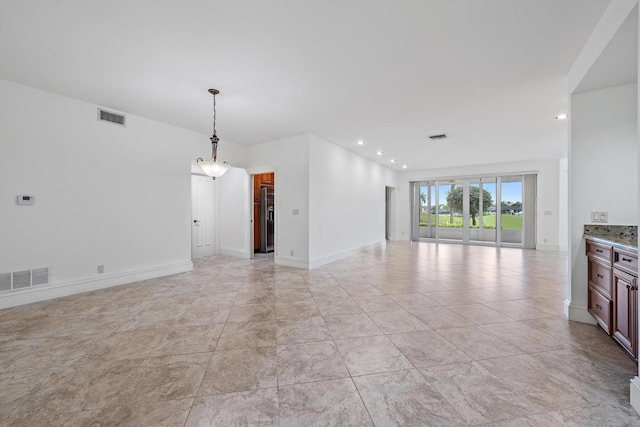 unfurnished living room featuring recessed lighting, visible vents, and baseboards