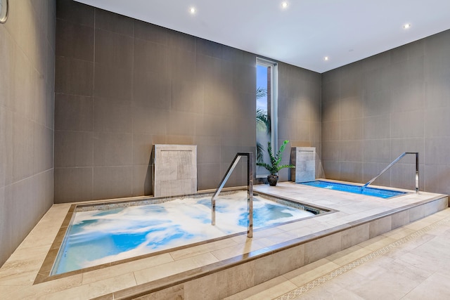 view of pool featuring an indoor hot tub