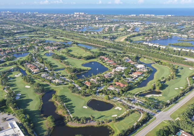 aerial view with a water view and golf course view