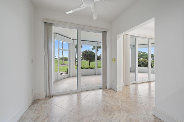 entryway with plenty of natural light, baseboards, and ceiling fan