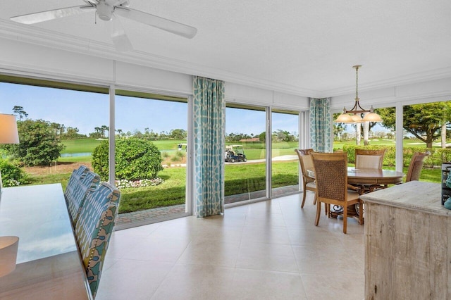 sunroom featuring ceiling fan