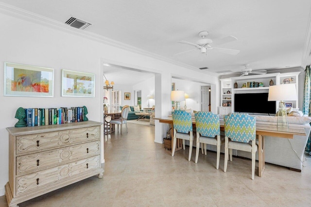 kitchen with visible vents, built in features, ornamental molding, open floor plan, and ceiling fan with notable chandelier