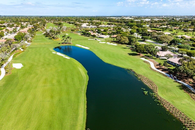 aerial view with golf course view and a water view