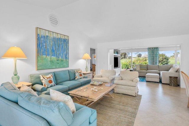 tiled living room with vaulted ceiling