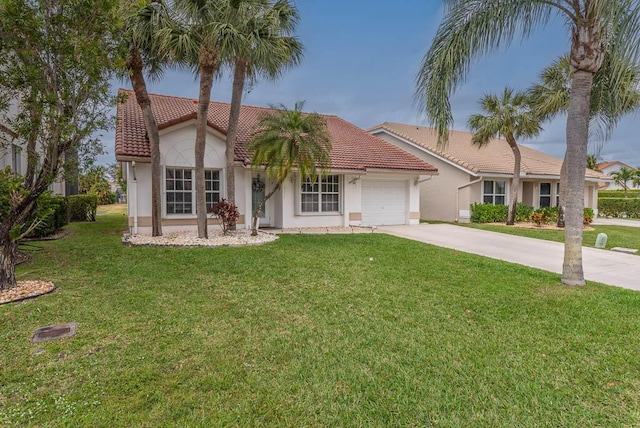 view of front of home with an attached garage, concrete driveway, a tiled roof, stucco siding, and a front yard