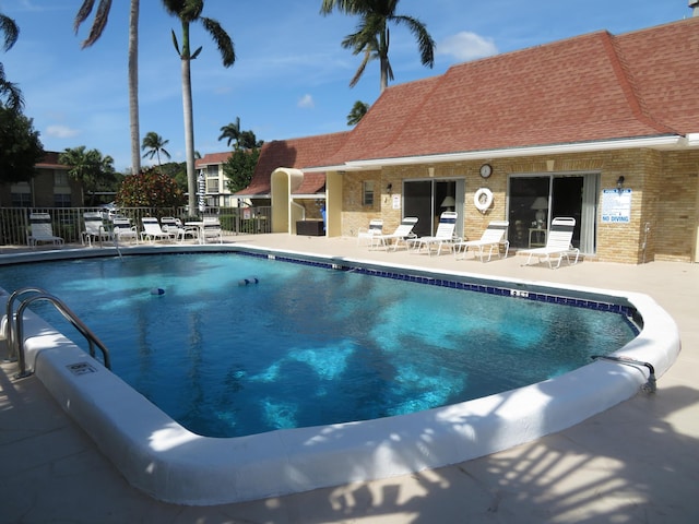 5580 Tamberlane Cir Unit 334, Palm Beach Gardens, FL 33418 - community pool featuring a patio