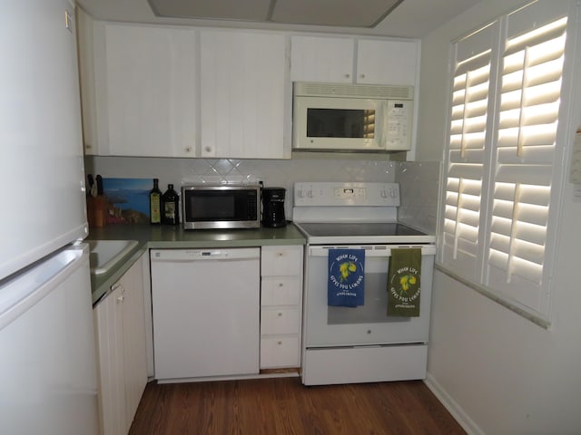 5580 Tamberlane Cir Unit 334, Palm Beach Gardens, FL 33418 - kitchen featuring white appliances, decorative backsplash, dark wood-style floors, and white cabinetry