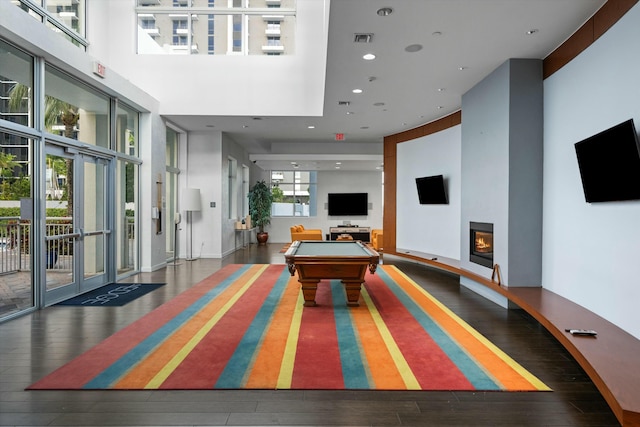 recreation room with a glass covered fireplace, visible vents, billiards, and hardwood / wood-style floors