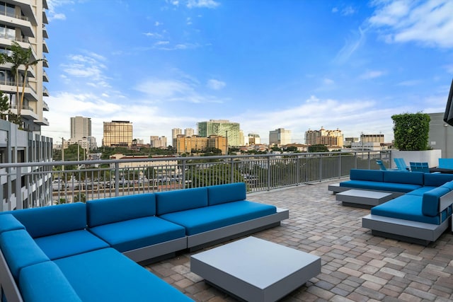 view of patio with a view of city and an outdoor hangout area