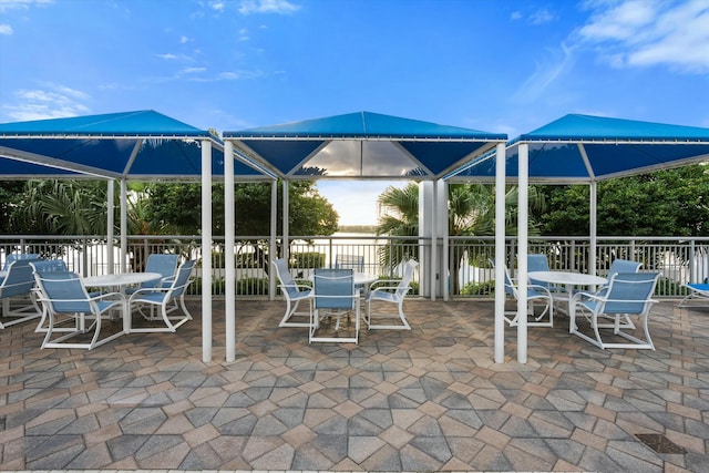 view of patio featuring a gazebo and outdoor dining space