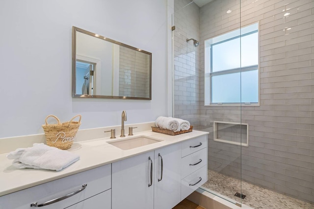 bathroom featuring a stall shower and vanity