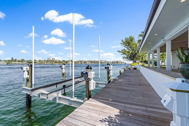 view of dock featuring a water view and boat lift