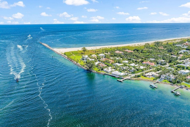 birds eye view of property featuring a view of the beach and a water view