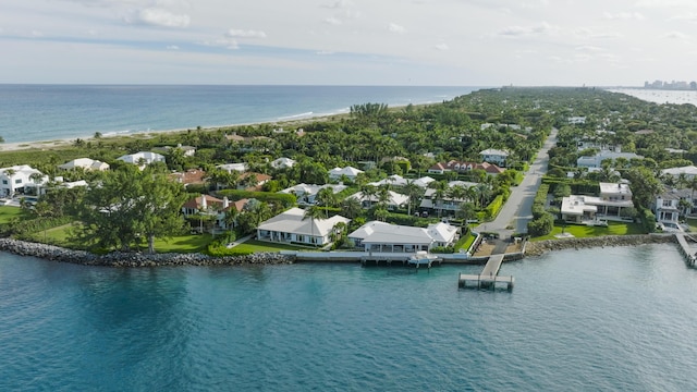 drone / aerial view featuring a water view and a residential view