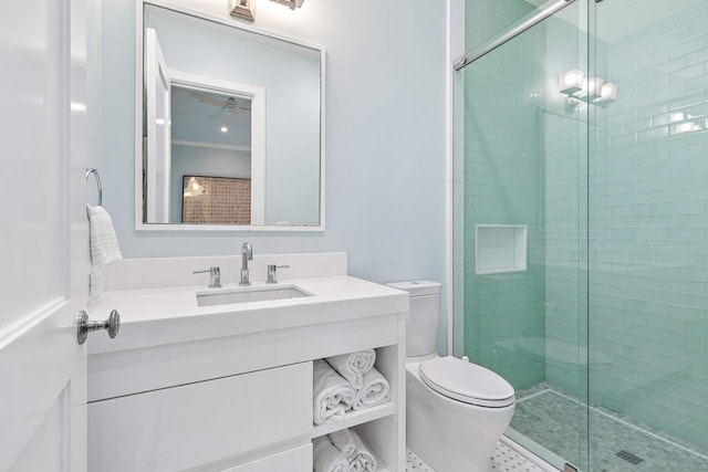 full bathroom with vanity, a shower stall, and toilet