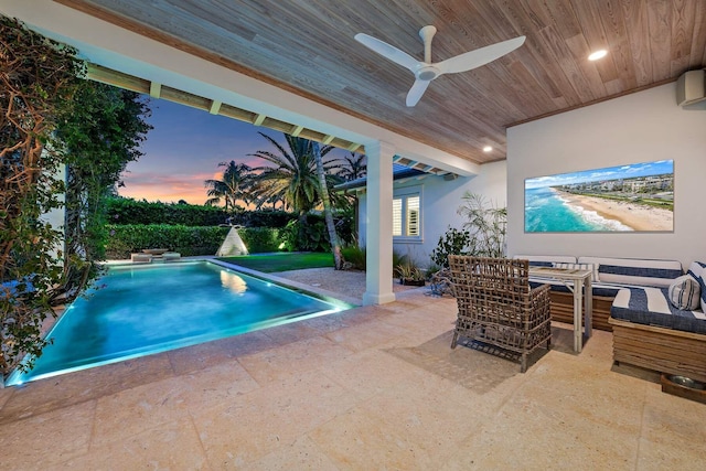 view of swimming pool featuring a patio area, ceiling fan, outdoor lounge area, and a fenced in pool