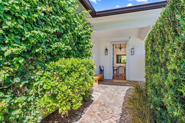 property entrance featuring stucco siding