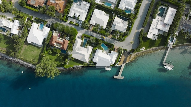 birds eye view of property with a residential view and a water view