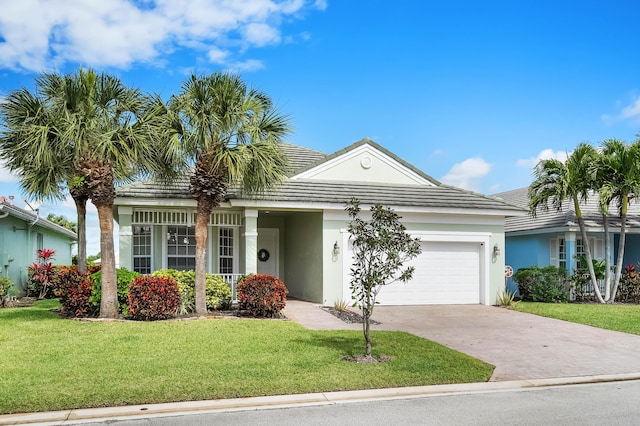 ranch-style house with stucco siding, concrete driveway, an attached garage, a tiled roof, and a front lawn