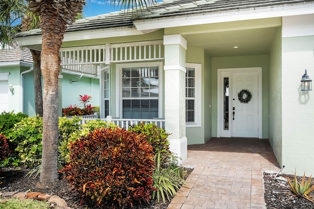 doorway to property with stucco siding