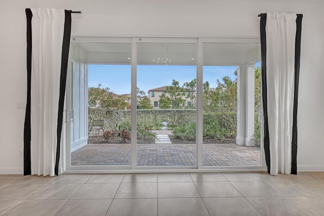 doorway featuring light tile patterned flooring