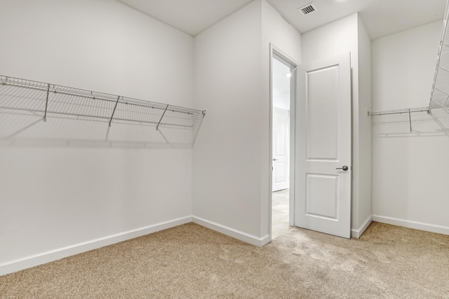 spacious closet with carpet and visible vents