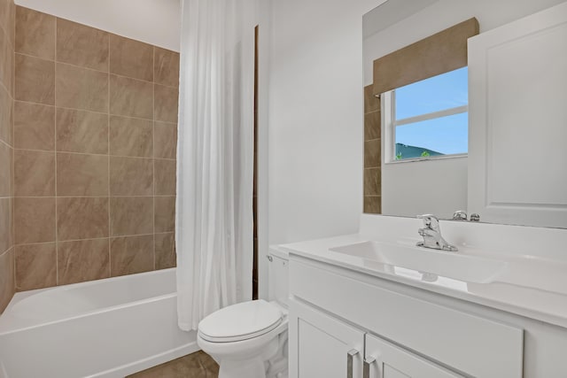 bathroom featuring shower / tub combo, vanity, and toilet