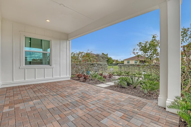 view of patio / terrace featuring fence