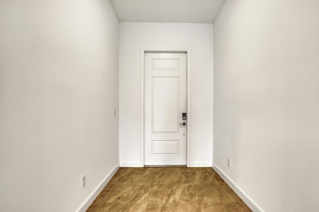 entryway featuring baseboards