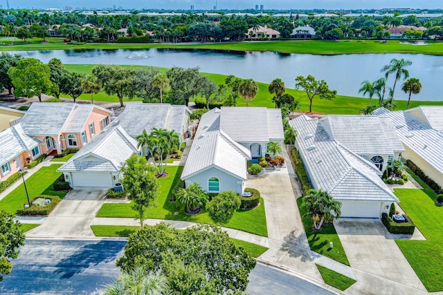 drone / aerial view with a water view and a residential view