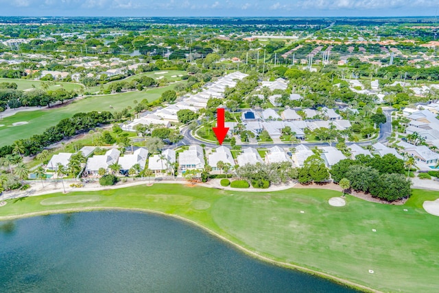 drone / aerial view featuring a residential view, a water view, and golf course view