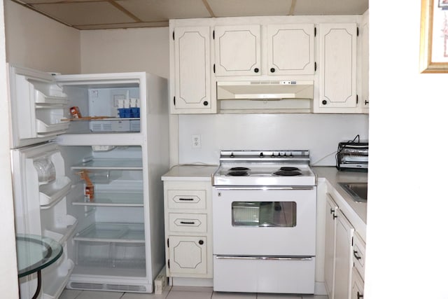 kitchen featuring white electric range oven, refrigerator, light countertops, white cabinets, and under cabinet range hood
