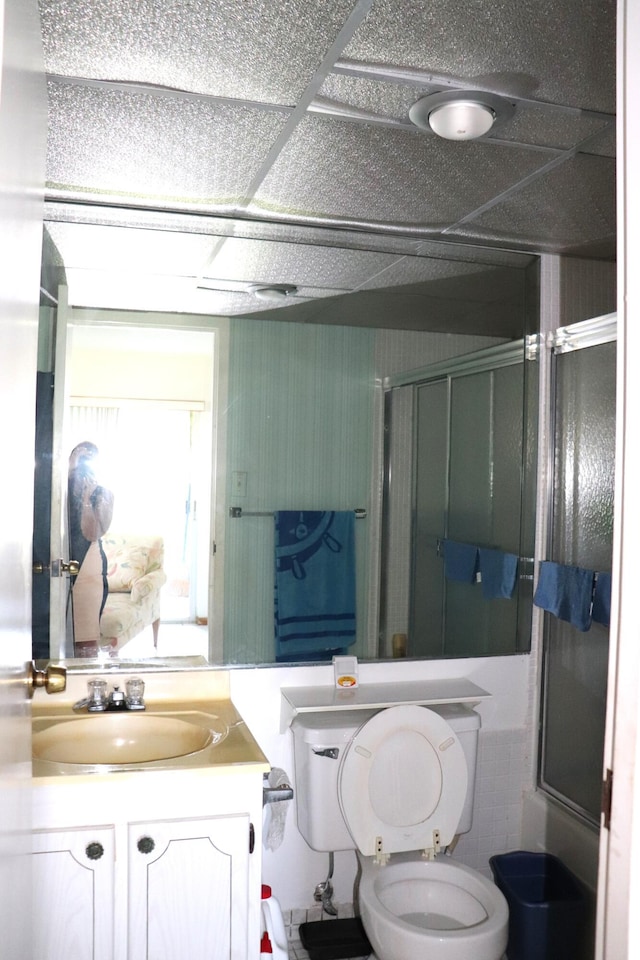 bathroom with vanity, toilet, and a stall shower