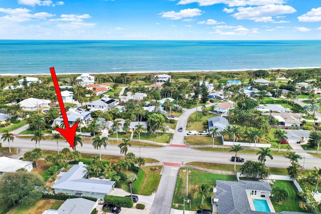 birds eye view of property featuring a water view and a residential view