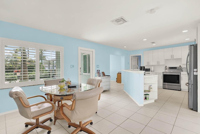 dining area with light tile patterned floors, baseboards, visible vents, and recessed lighting