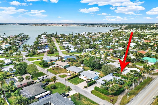 birds eye view of property featuring a water view and a residential view